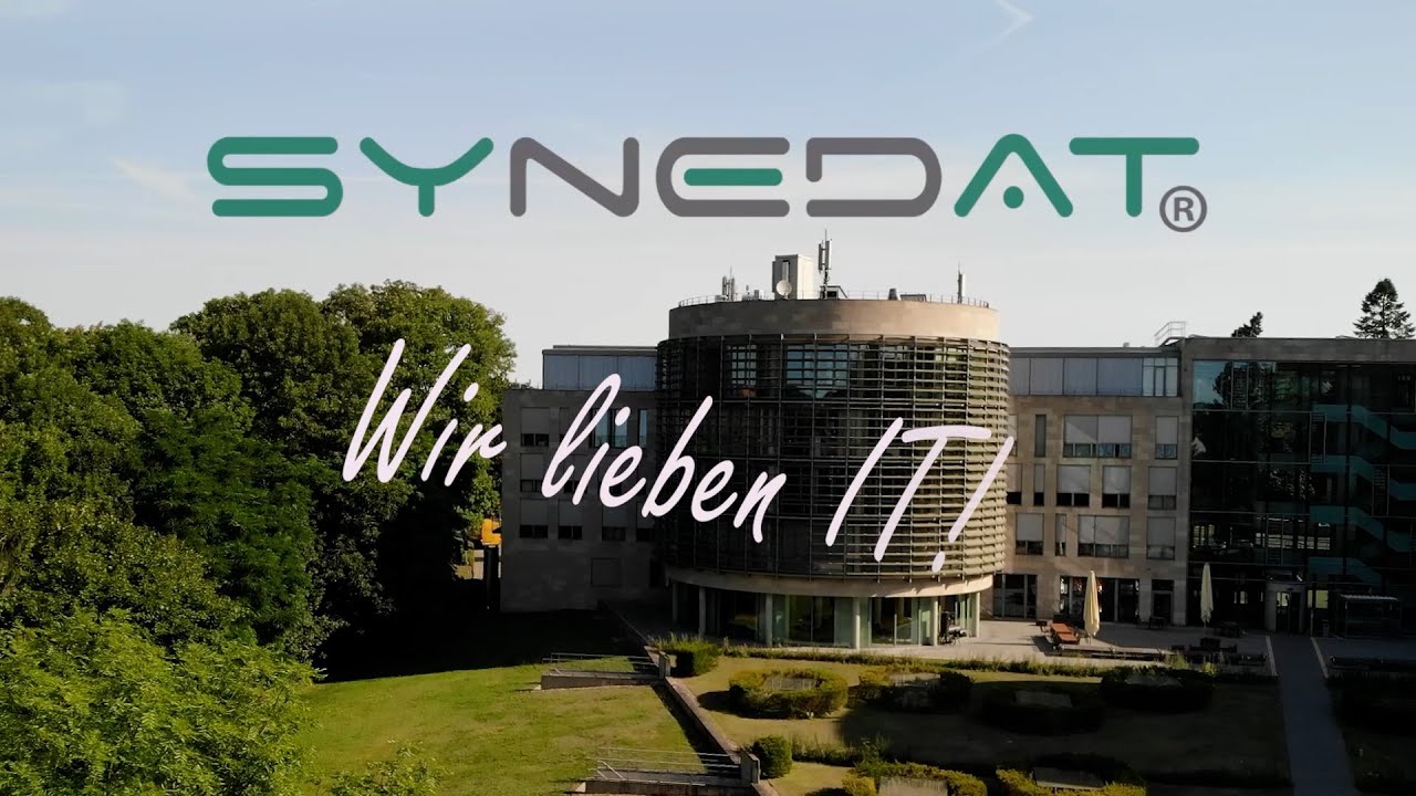 SYNEDAT company film showing the office building and the words ‘We love IT!’.